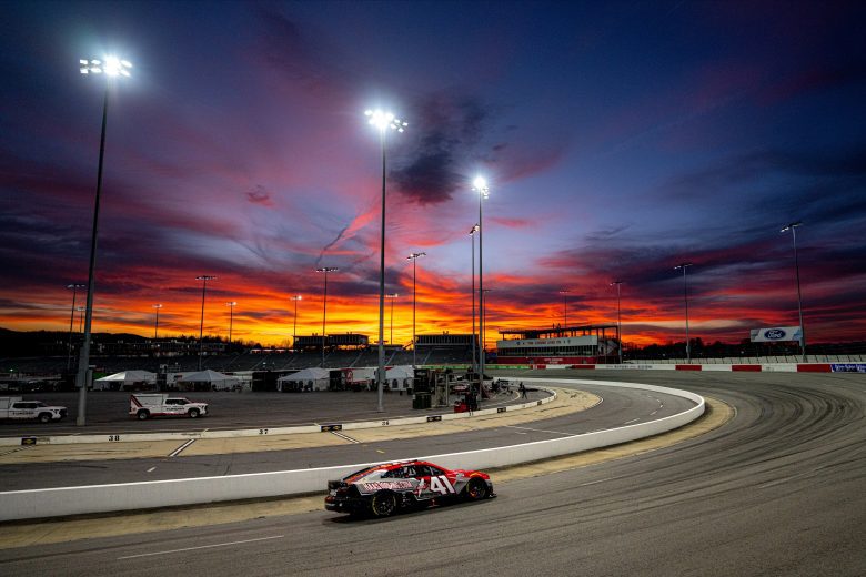 Cole Custer drives No. 41 Ford at North Wilkesboro Speedway during sunset.