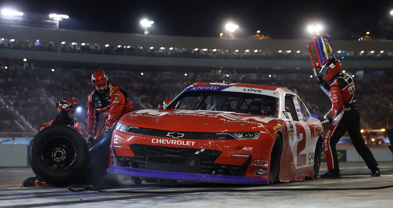 Jesse Love makes a pit stop during a NASCAR O'Reilly Auto Parts Series race.
