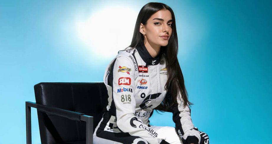 Toni Breidinger in a photo shoot with her 2026 Rackley WAR driver's suit