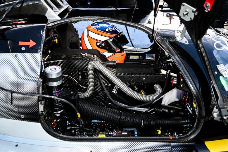 Jordan Taylor sits inside his car.