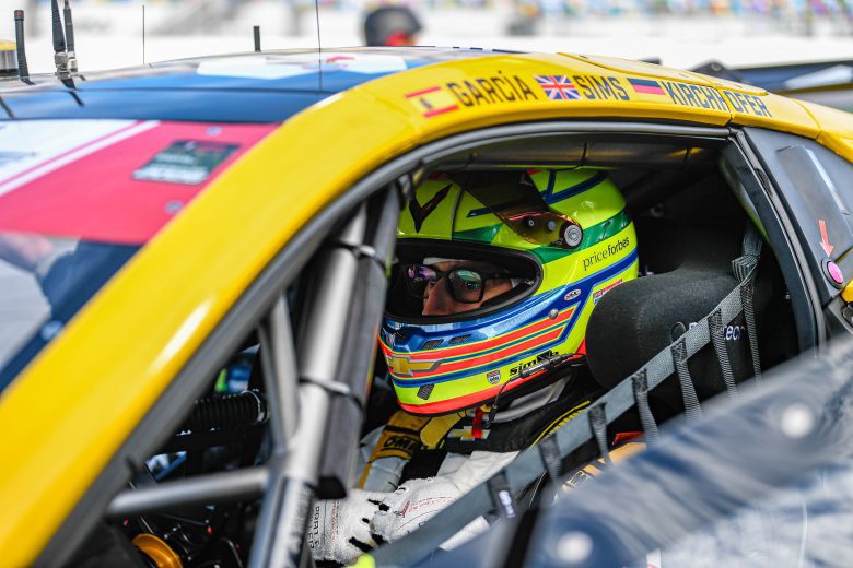 Alexander Sims sits in his car.