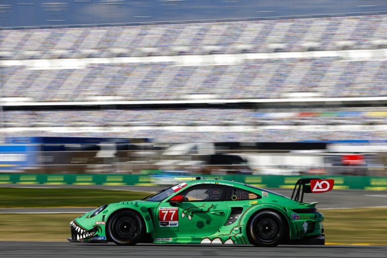 The No. 77 AO Racing Porsche drives at Daytona.