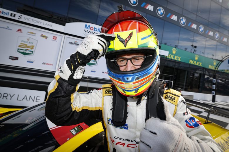 Alexander Sims celebrates after winning the GTD Pro pole.