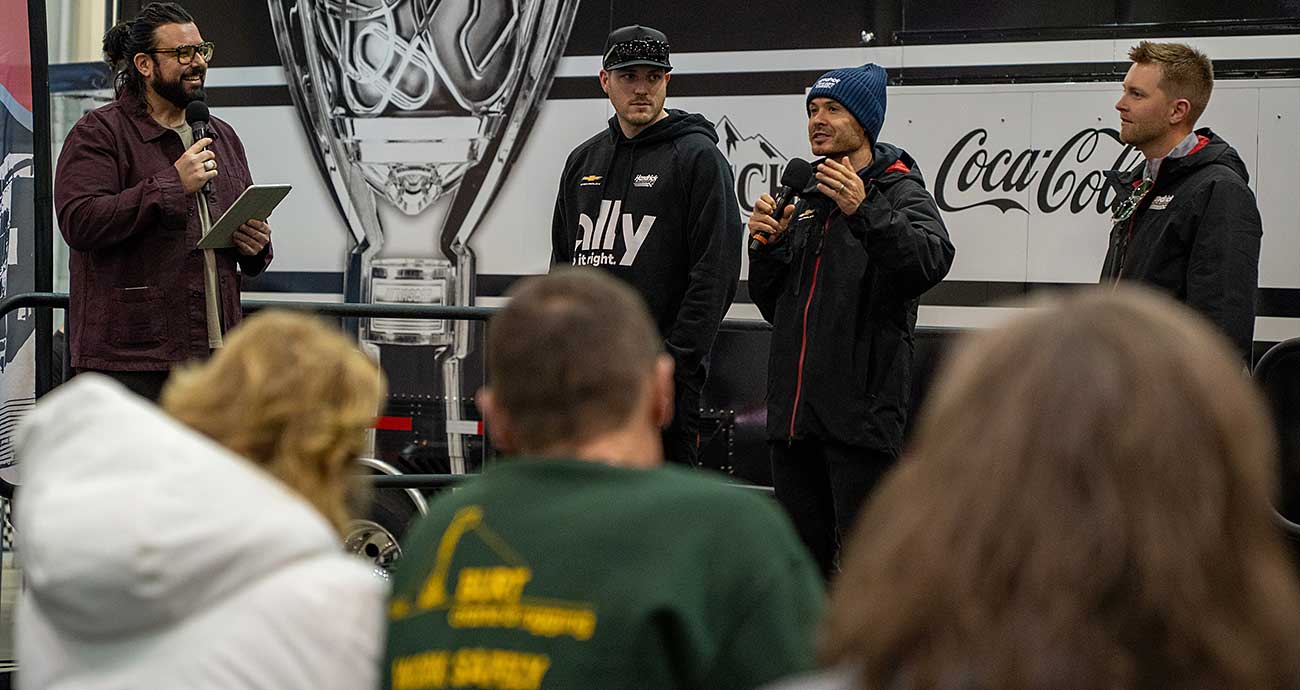 Cup Series champion Kyle Larson speaks to the fans alongside teammates Alex Bowman and William Byron during the Clash Preview at the Winston-Salem Fairgrounds