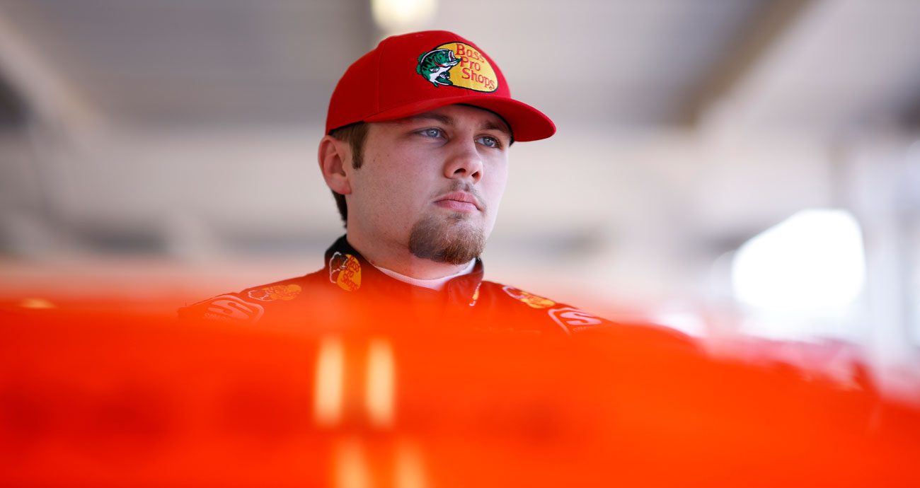Carson Kvapil looks on.