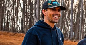Niece Motorsports president and CEO Cody Efaw smiles as watches activity at the team's dirt track