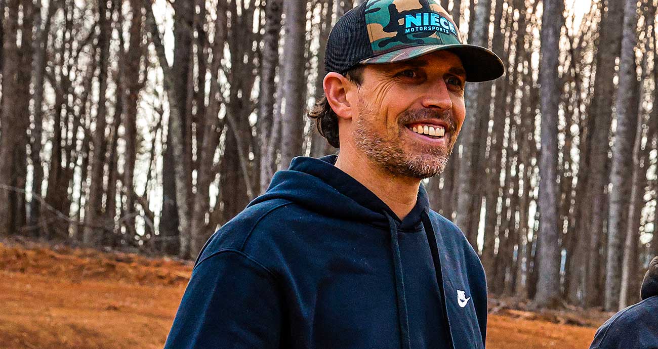 Niece Motorsports president and CEO Cody Efaw smiles as watches activity at the team