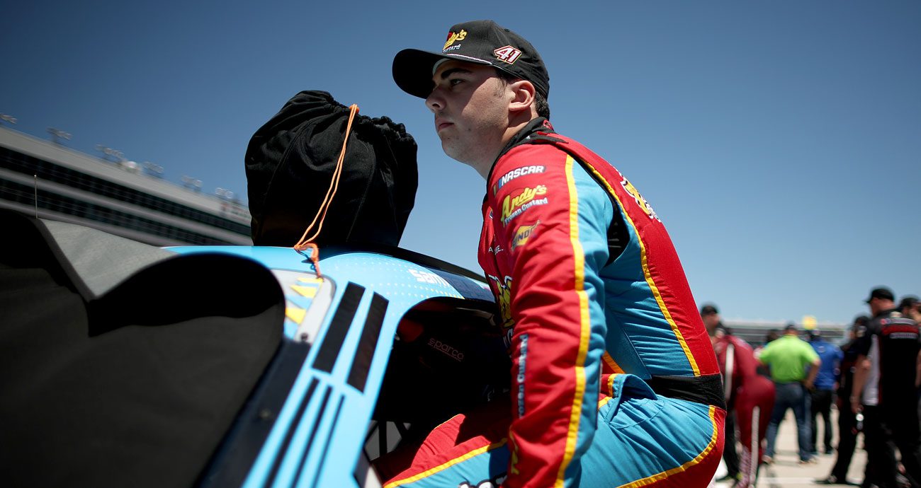 Sam Mayer enters his vehicle before a NASCAR O'Reilly Auto Parts Series race.