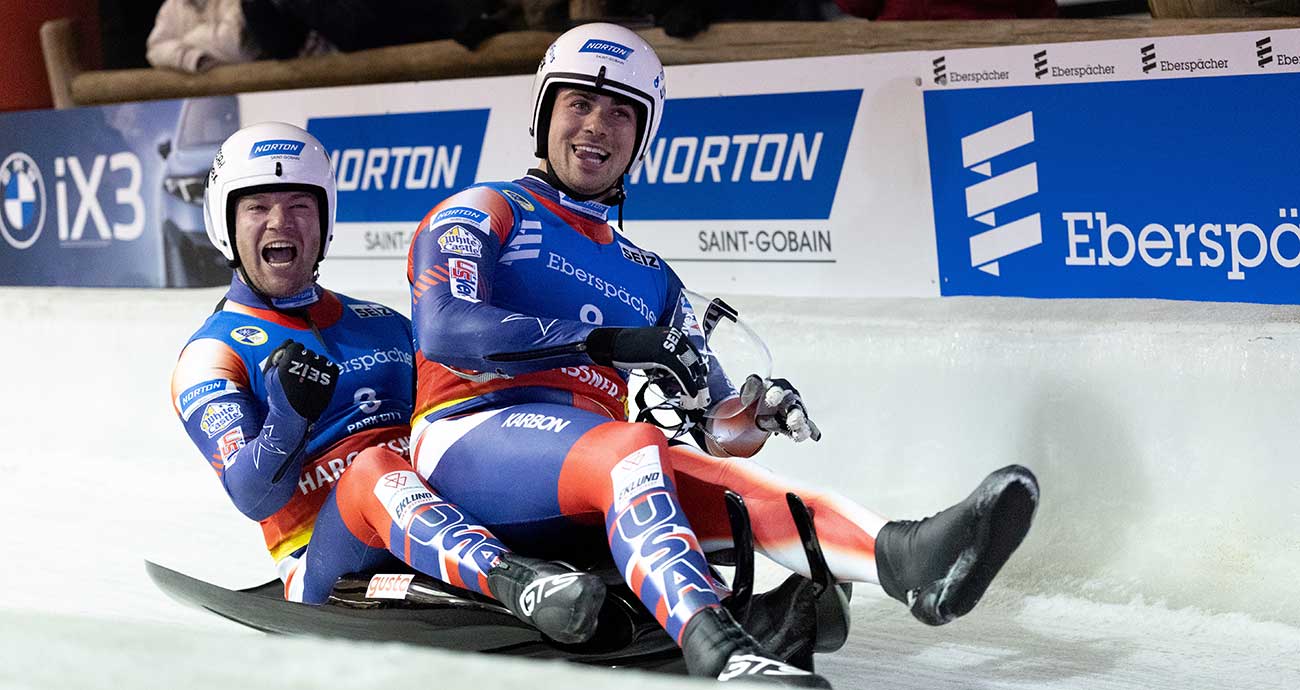 Team USA teammates Zachary DiGregorio, right, and Sean Hollander celebrate a silver-medal run in the Eberspächer Luge World Cup event in Park City, Utah, on Dec. 13, 2025.