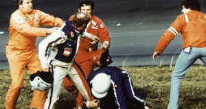 Track emergency workers try to break up a fight between Cale Yarborough, Donnie Allison and Bobby Allison after Yarborough and Donnie Allison crashed on the final lap while battling for the lead in the Daytona 500 at Daytona International Speedway.