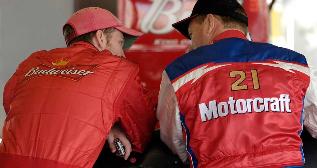 Dale Earnhardt Jr., left, and Ken Schrader chat during preseason testing in 2006 at Daytona International Speedway