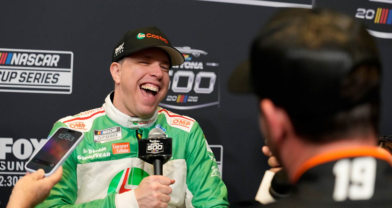 Brad Keselowski shares a laugh with Chase Briscoe during Daytona 500 Media Day