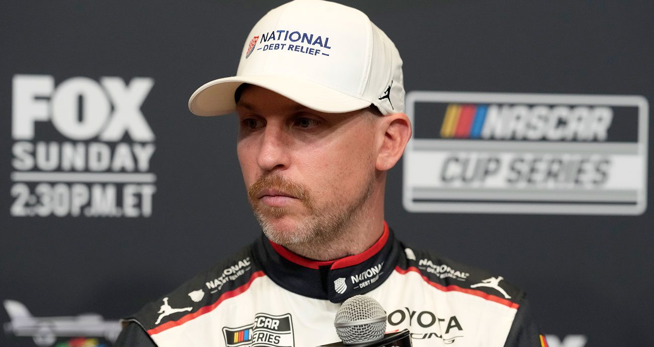 Denny Hamlin looks on.