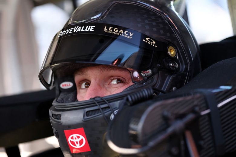 John Hunter Nemechek looks on.