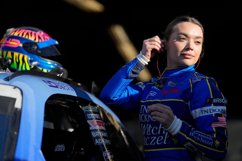 Natalie Decker looks on.