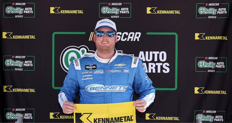 Austin Hill celebrates after winning the pole at Daytona.