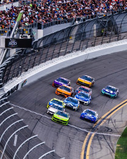 Zane Smith leads a group of NASCAR Cup Series cars at Daytona.