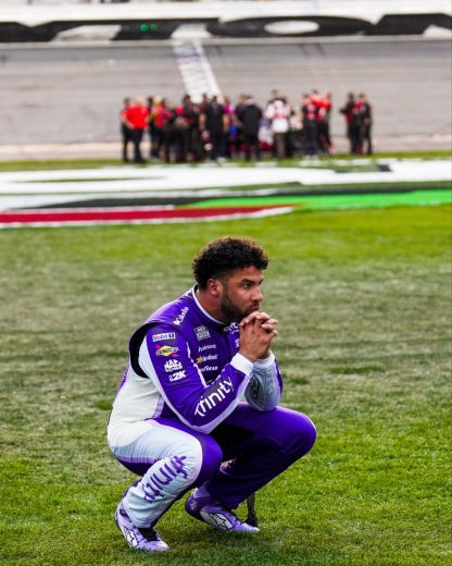 Bubba Wallace crouches after the Daytona 500.