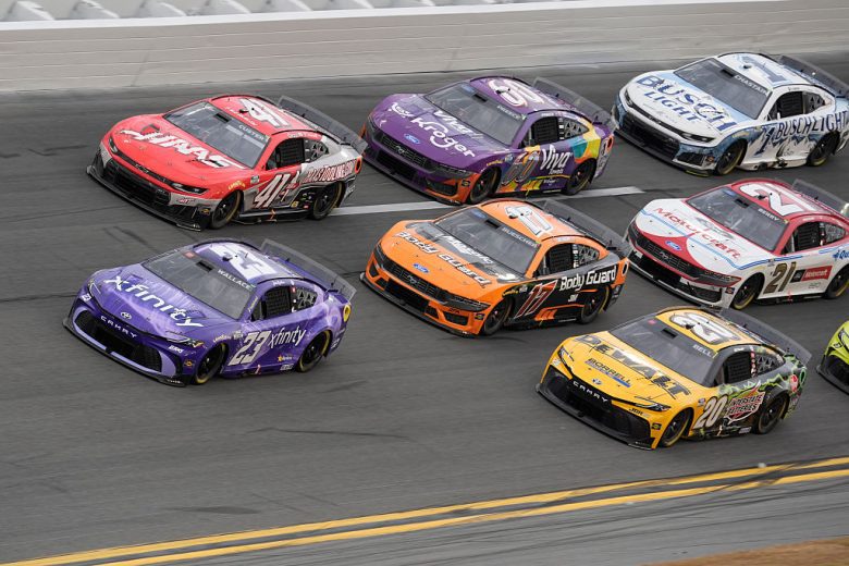 NASCAR Cup Series cars race at Daytona International Speedway.