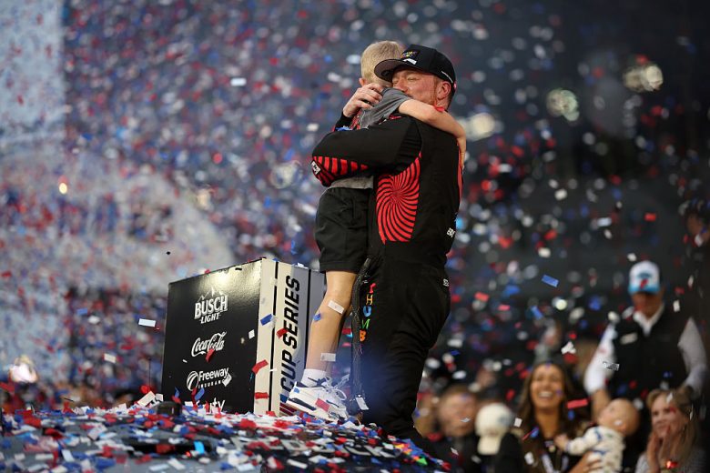 Tyler Reddick hugs his son, Beau, in Victory Lane.