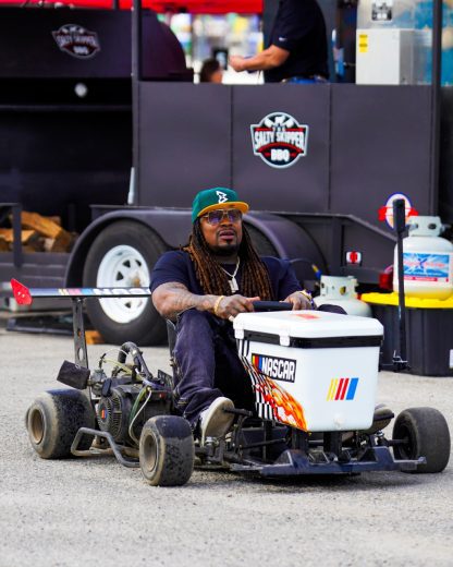 Marshawn Lynch rides a NASCOOLER kart.