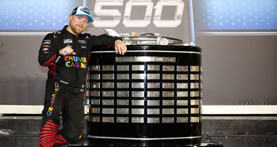 Tyler Reddick poses for a photo in Victory Lane at Daytona.