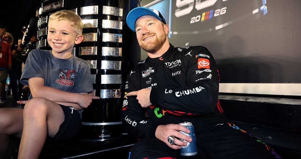 Tyler Reddick and his son Beau show off the latest addition to the Harley J. Earl Trophy