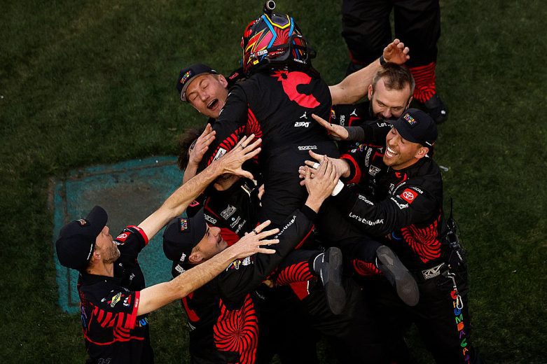 Tyler Reddick embraces his No. 45 pit crew.