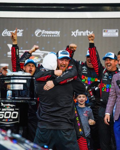 Tyler Reddick embraces Michael Jordan in Victoryb Lane