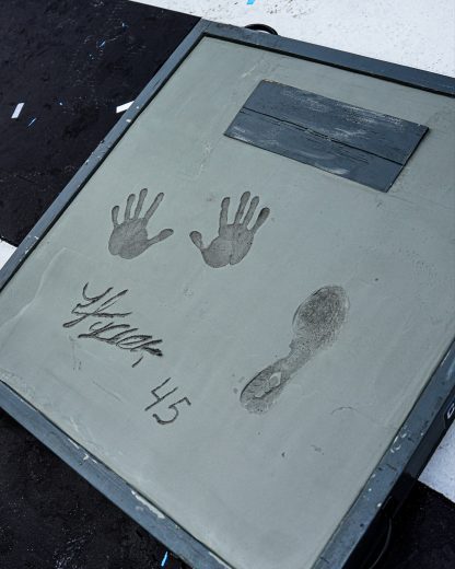 A view of Tyler Reddick's hand and foot imprints.