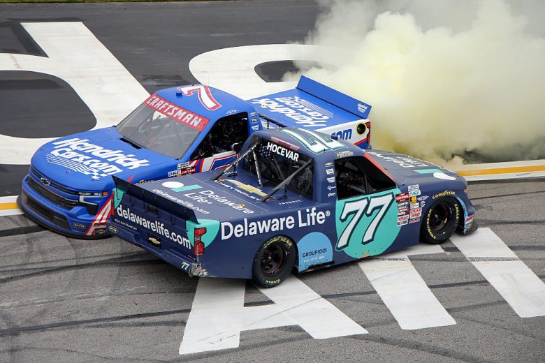 Carson Hocevar greets Kyle Busch.