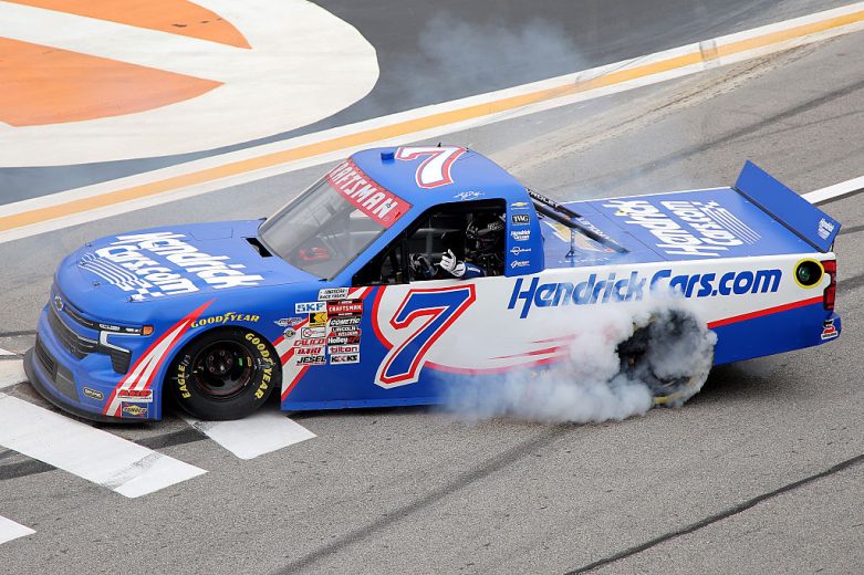 Kyle Busch celebrates with a burnout after winning at EchoPark Speedway.