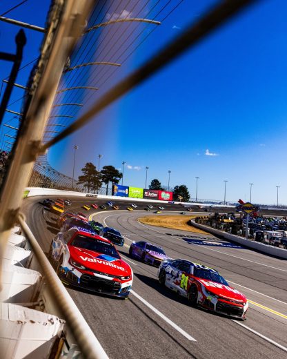 NASCAR Cup Series cars race at EchoPark Speedway.