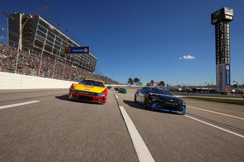 NASCAR Cup Series cars race at EchoPark Speedway.