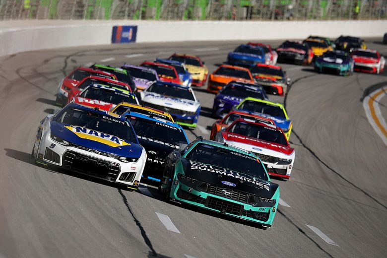 NASCAR Cup Series cars race at EchoPark Speedway.
