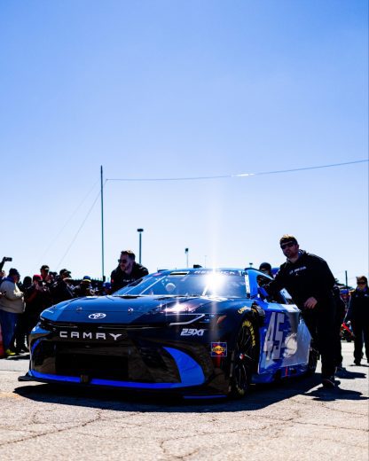 The No. 45 Toyota of Tyler Reddick gets pushed to pit road.
