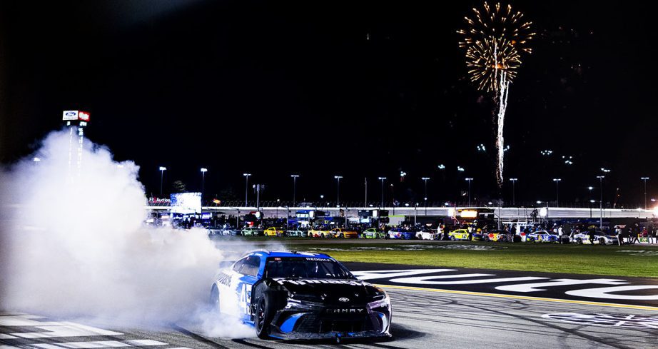 View of Tyler Reddick celebrating with a burnout at EchoPark Speedway.