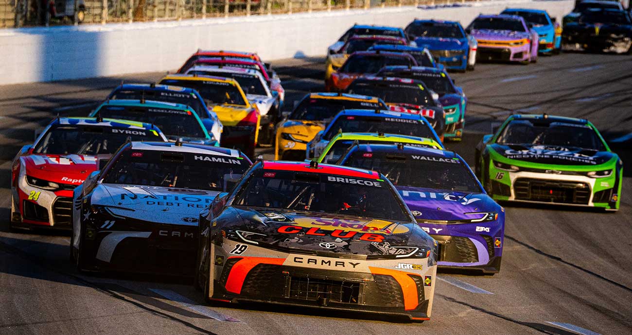 Chase Briscoe's No. 19 Toyota leads the pack through the dogleg frontstretch at EchoPark Speedway