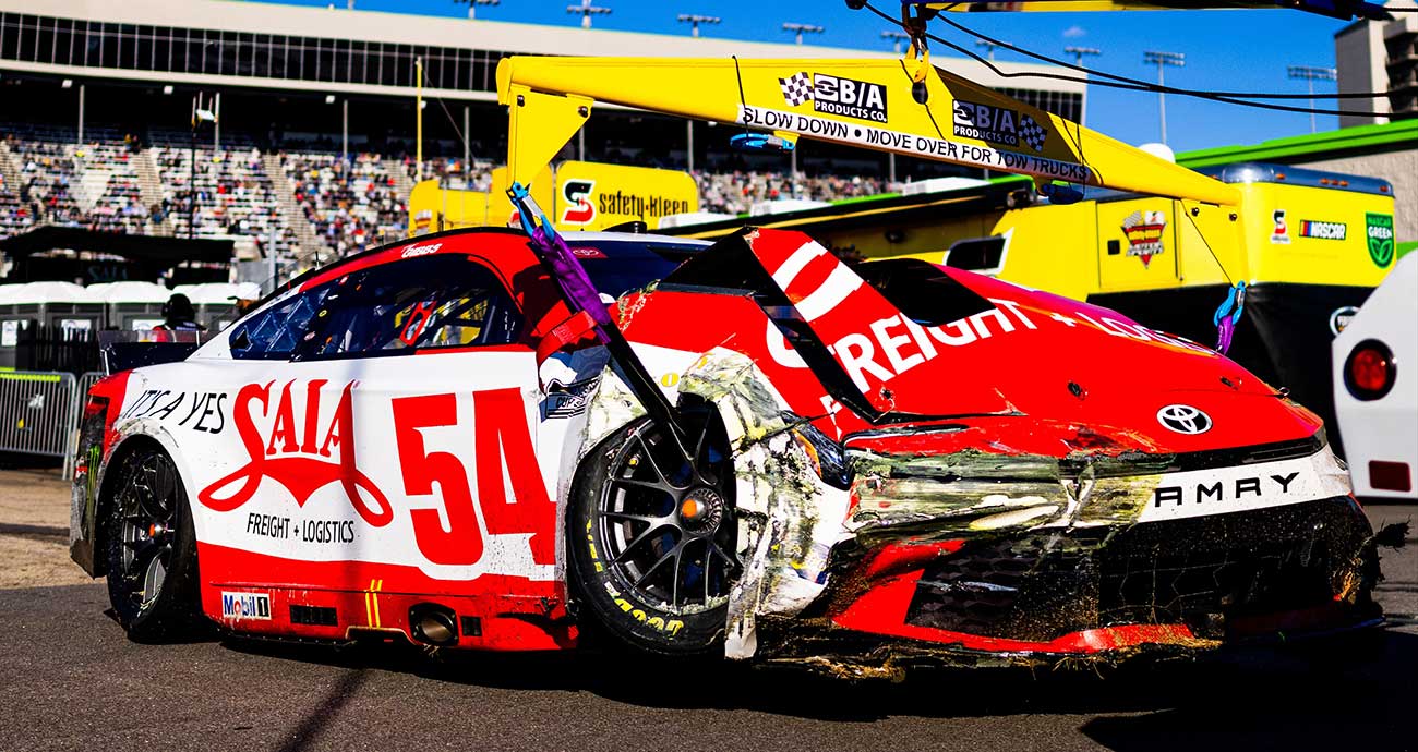 The damaged No. 54 Toyota of Ty Gibbs gets a tow back to the Cup Series garage at EchoPark Speedway