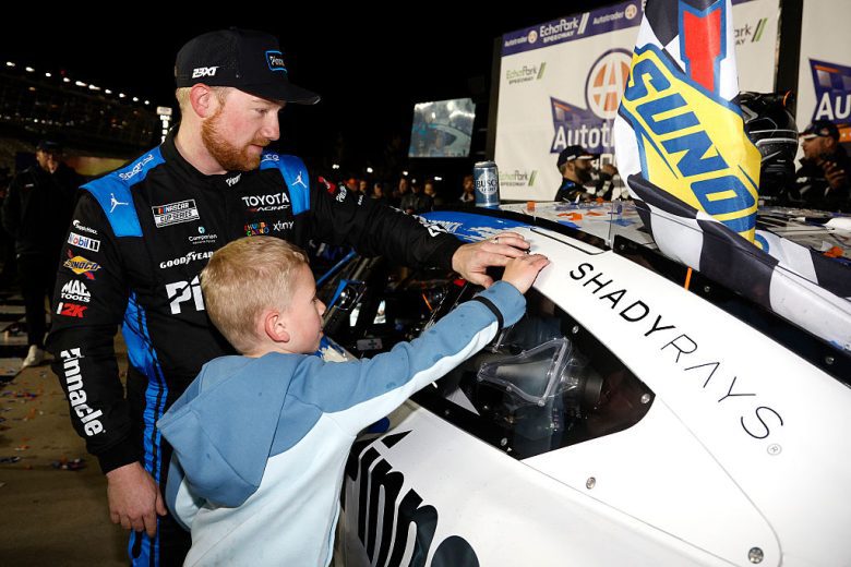 Beau puts the winner sticker on Tyler Reddick's No. 45 Toyota.