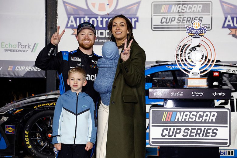Tyler Reddick poses for a photo with his family in Victory Lane at EchoPark Speedway.
