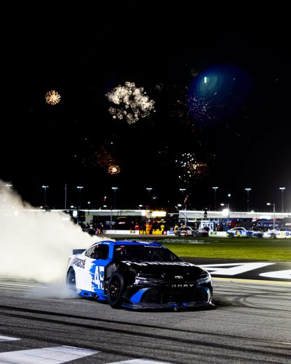 Tyler Reddick does a celebratory burnout.