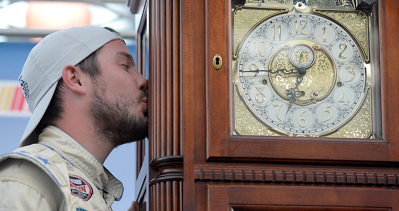 Lee Pulliam kisses a grandfather clock.