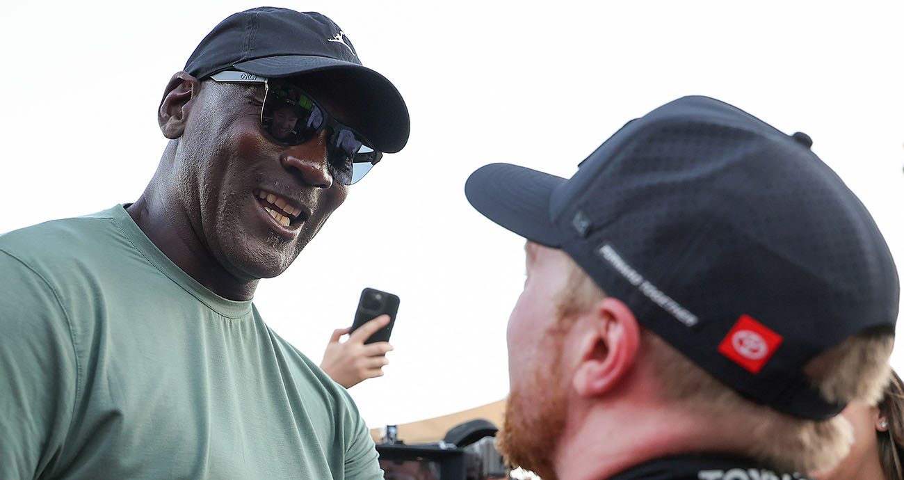 michael jordan and tyler reddick celebrate after cota