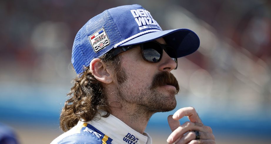 Ryan Blaney looks on.