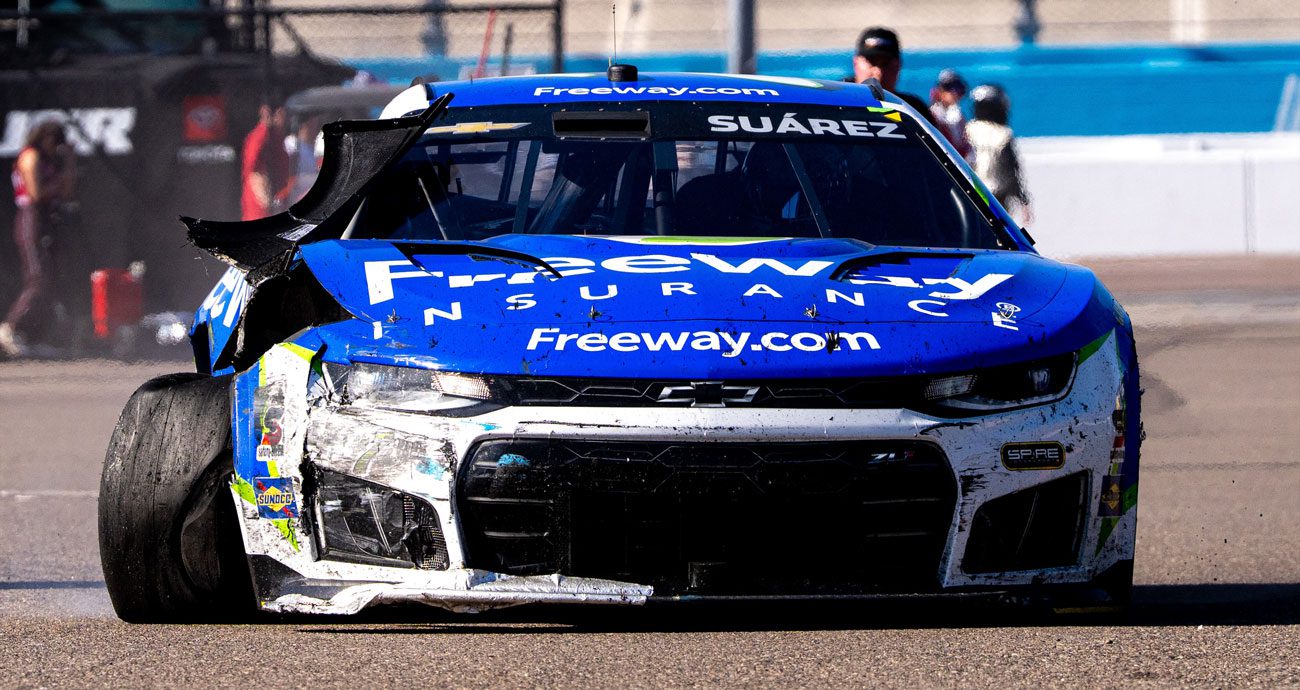 Daniel Suárez drives his car to the Phoenix garage after a crash.