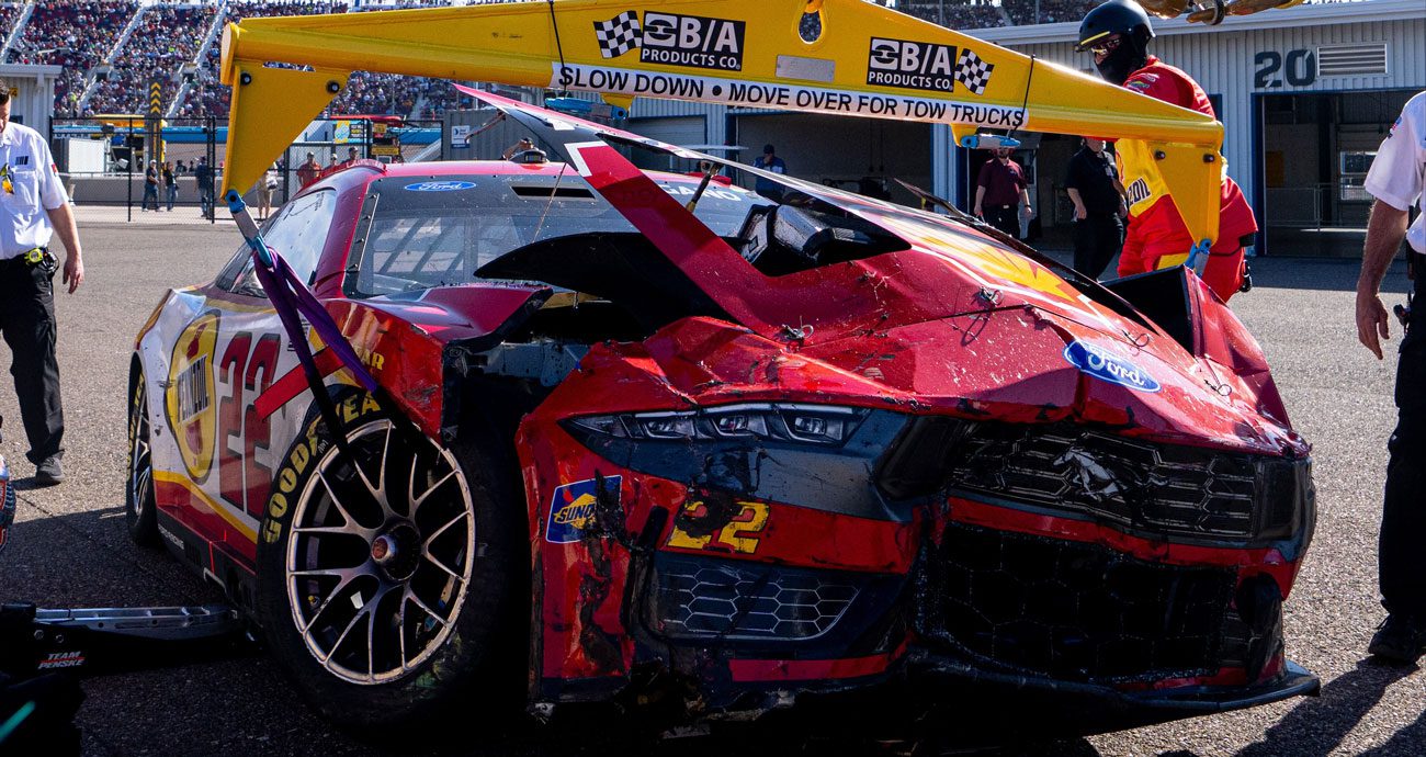 Joey Logano's wrecked car sits in the Phoenix garage.