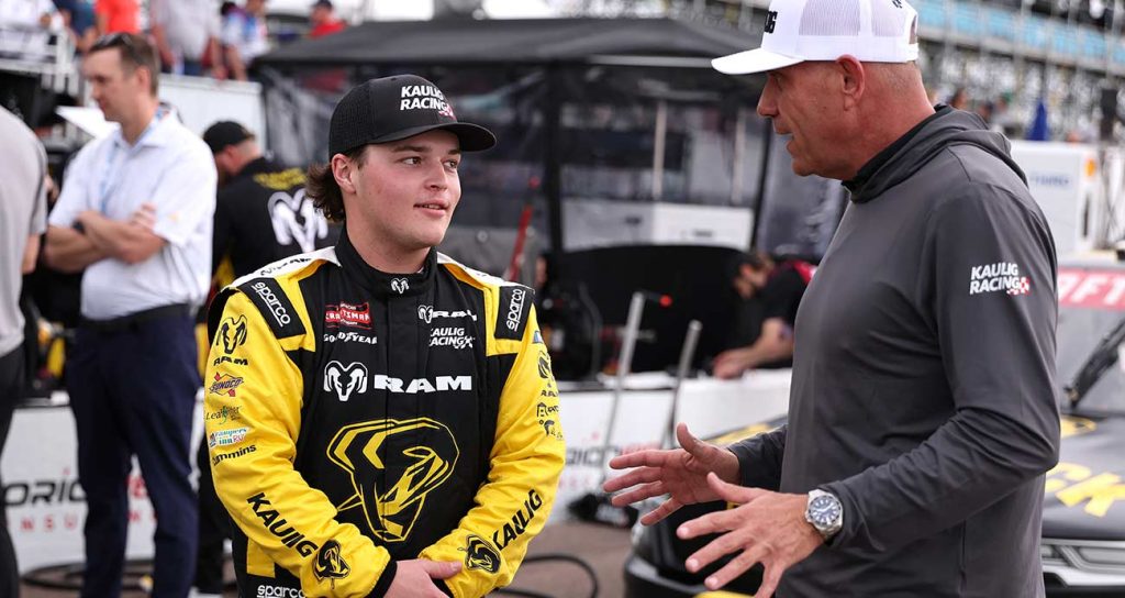 Kaulig Racing president Chris Rice talks on pit road with Mini Tyrrell at Daytona International Speedway.