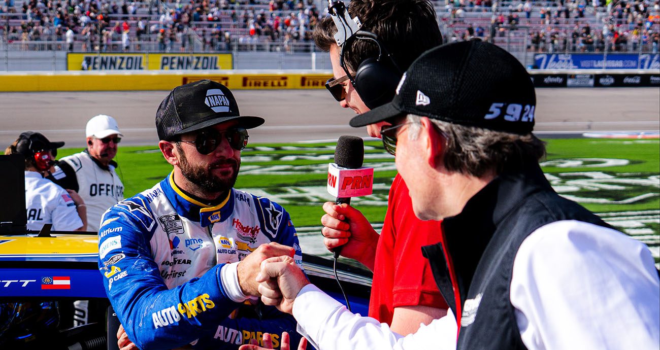 elliott gives fist bump to jeff gordon