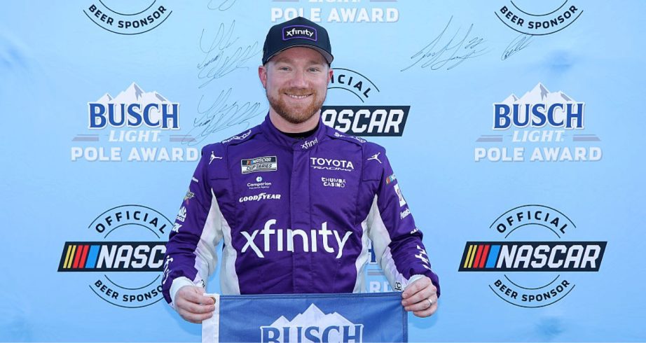 Tyler Reddick celebrates after winning the pole at Darlington.